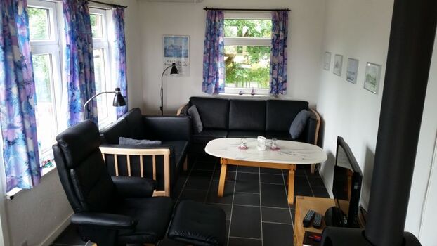 Wohnzimmer mit Holzofen - Fußbodenheizung