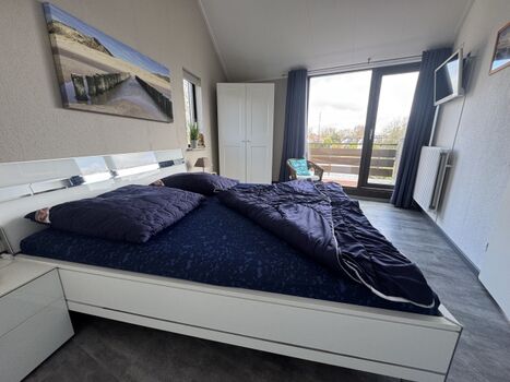 Schlafzimmer mit Balkon