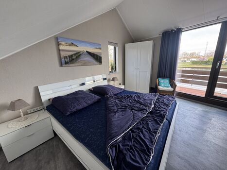 Schlafzimmer mit Balkon