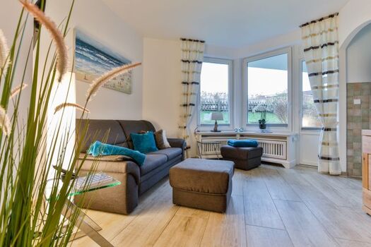 Wohnzimmer mit Terrassenzugang -  Strandperle Sylt in Westerland