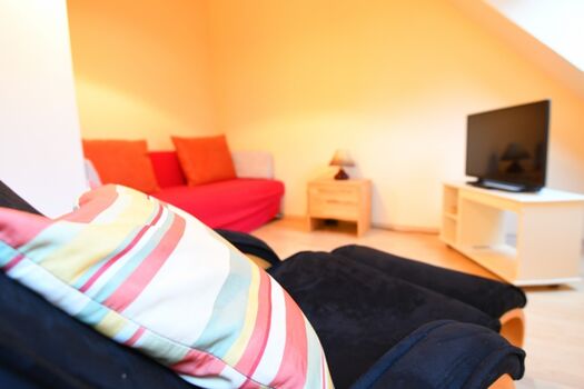 Wohnzimmer im Obergeschoss mit Schlafsofa