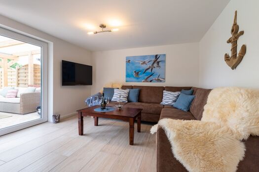 Wohnzimmer mit Zugang zur Terrasse