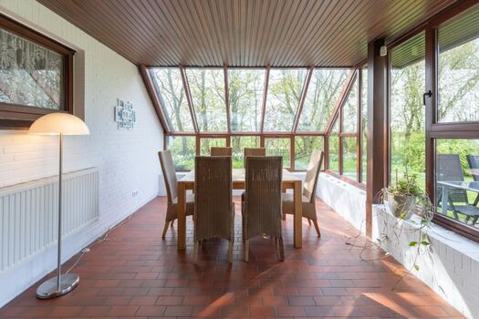 Haus am Deich - Wintergarten mit tollem Ausblick in den Garten 