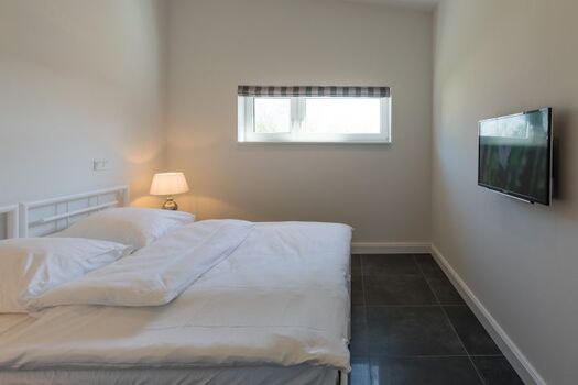 Hannes Huis - Schlafzimmer mit großem Doppelbett